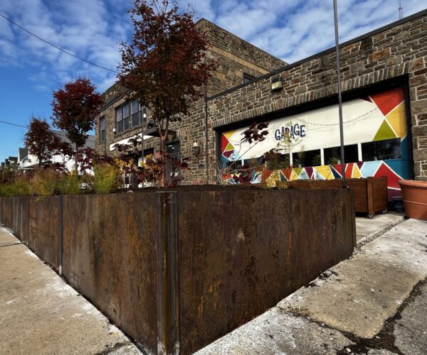 The Garage Youth Center with its new raised garden bed at the front of the building.